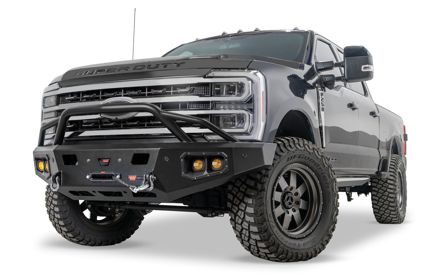 WARN Ascent HD front bumper for Ford F250 - F600 featuring a pre-runner style grille guard and integrated winch mount that will accept large or mid-frame winches up to 18,000 lbs in capacity.