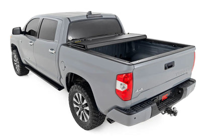 Rough Country Hard Tri-Fold Flip Up Bed Cover | 5'7" Bed | Toyota Tundra 2WD/4WD (07-21) by Rough Country