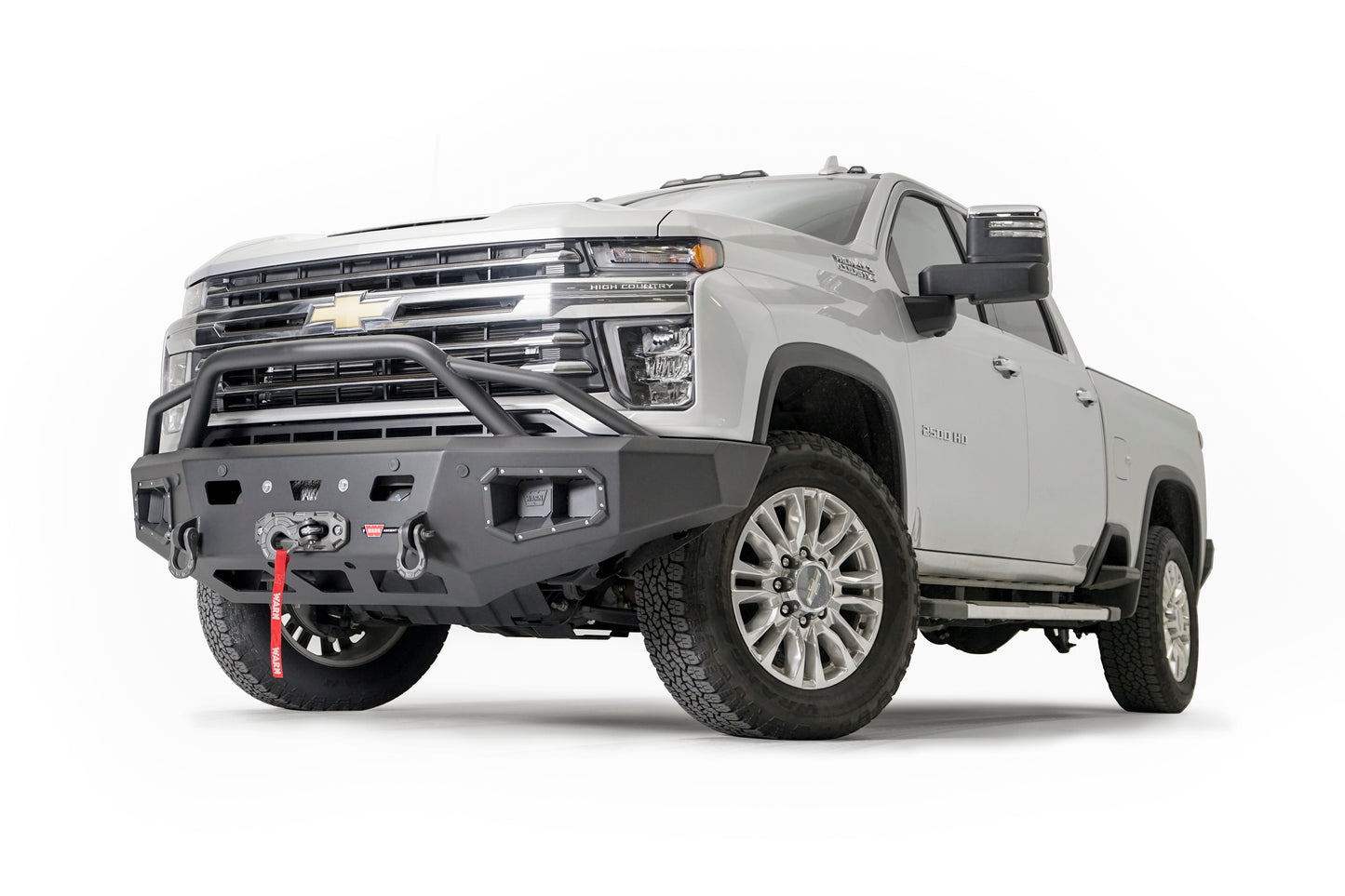 WARN Ascent HD front bumper for CHEVY 2500/3500 featuring a pre-runner style grille guard and integrated winch mount that will accept large or mid-frame winches up to 18,000 lbs in capacity.