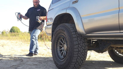 Air Lift’s Digital Portable Compressor is a portable compressor with a digital gauge showing the pressure reading, a 7-way power adapter, and an alligator-style battery clamp power adapter. It can inflate air springs, tires, and toys.