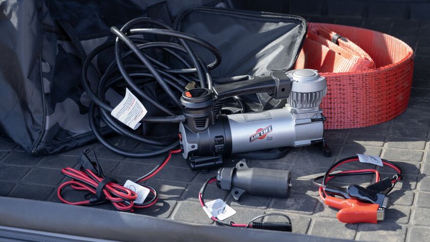 Air Lift’s Digital Portable Compressor is a portable compressor with a digital gauge showing the pressure reading, a 7-way power adapter, and an alligator-style battery clamp power adapter. It can inflate air springs, tires, and toys.