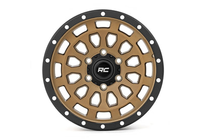 Rueda Rough Country Serie 87 | Beadlock simulado | Bronce/Negro | 17x8.5 | 5x5 | +0mm