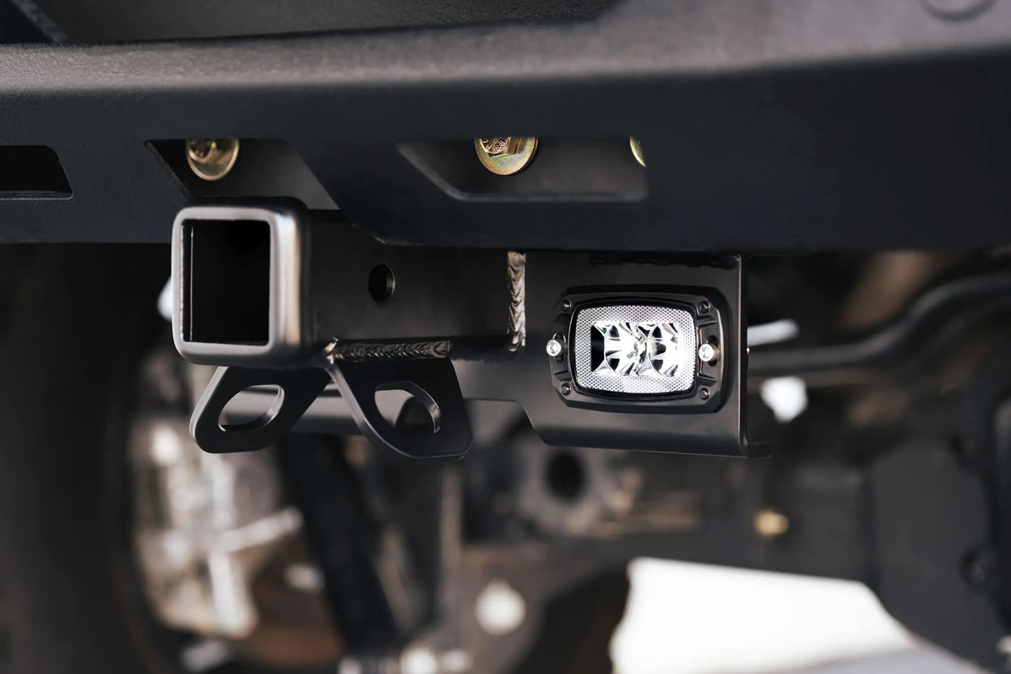 DV8 Offroad AHJP-02 is a bolt on hitch for the 07-22 Jeep Wrangler JK & JL. Constructed from steel & protected with a flat black powder coat, the hitch offers a 2in. receiver mount, (2) 3in. cube lights & installs in the factory location by DV8 Offroad