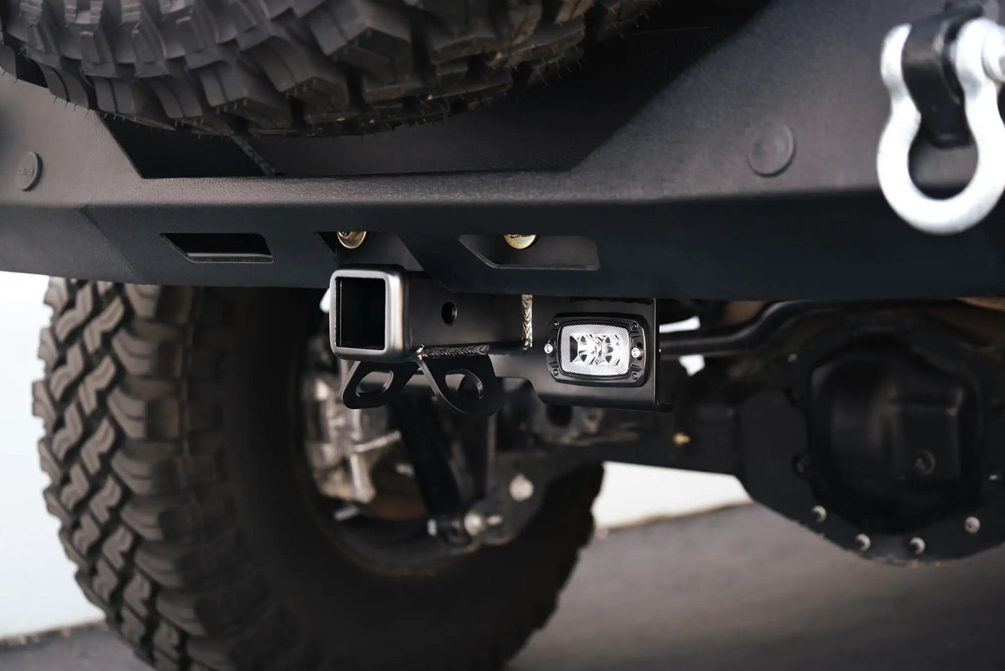 DV8 Offroad AHJP-02 is a bolt on hitch for the 07-22 Jeep Wrangler JK & JL. Constructed from steel & protected with a flat black powder coat, the hitch offers a 2in. receiver mount, (2) 3in. cube lights & installs in the factory location by DV8 Offroad