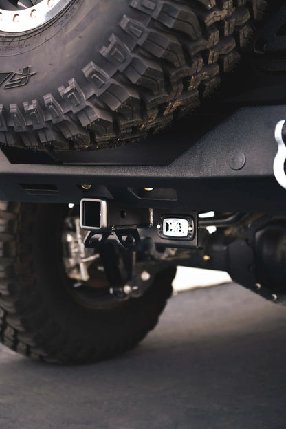 DV8 Offroad AHJP-02 is a bolt on hitch for the 07-22 Jeep Wrangler JK & JL. Constructed from steel & protected with a flat black powder coat, the hitch offers a 2in. receiver mount, (2) 3in. cube lights & installs in the factory location by DV8 Offroad