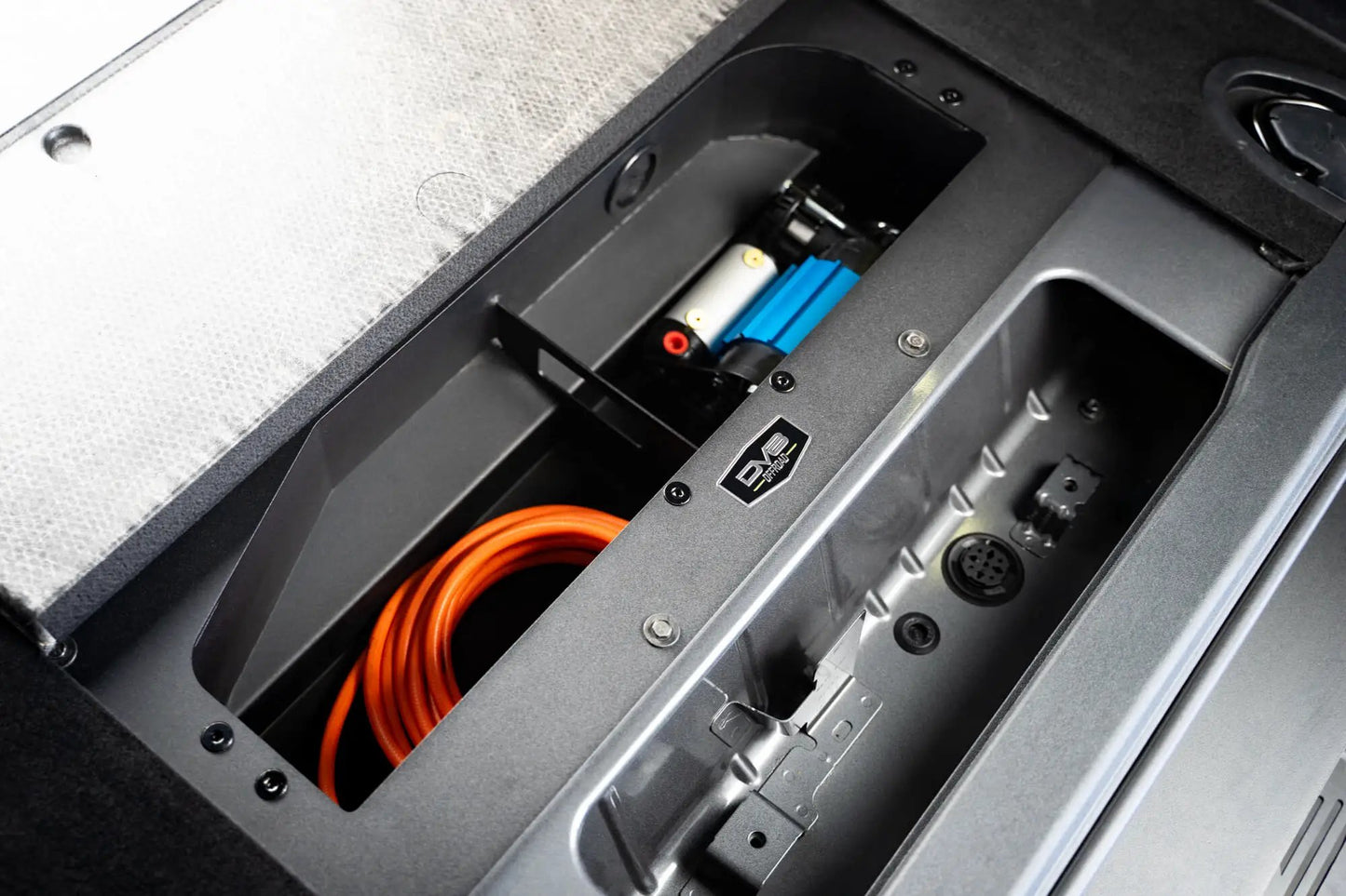 DV8 Offroad Hides the compressor in a convenient spot utilizing the factory mounting location. by DV8 Offroad