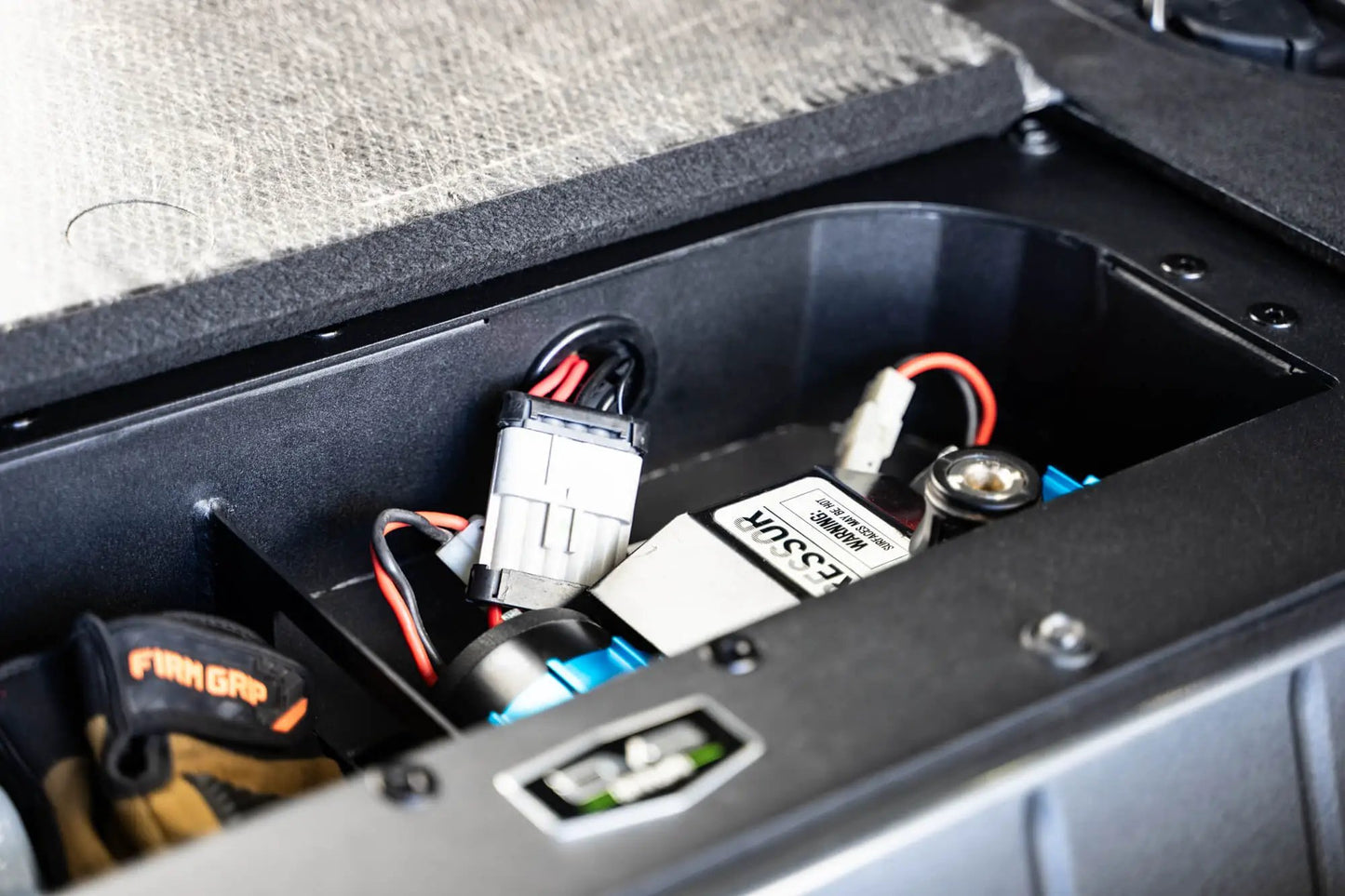 DV8 Offroad Hides the compressor in a convenient spot utilizing the factory mounting location. by DV8 Offroad