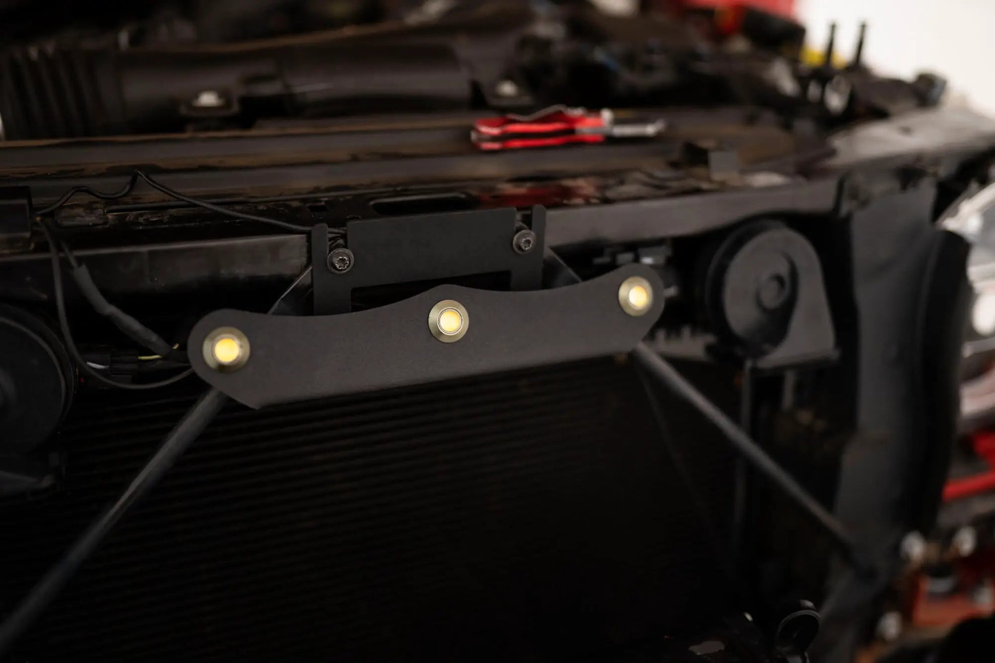 DV8 Offroad Set of three amber accent lights that install inside the front grill of the 20+ Jeep Gladiator JT. The mounting bracket is constructed from steel & powder coated & the LED lights allow your vehicle to be seen easier in low situations by DV8 Offroad