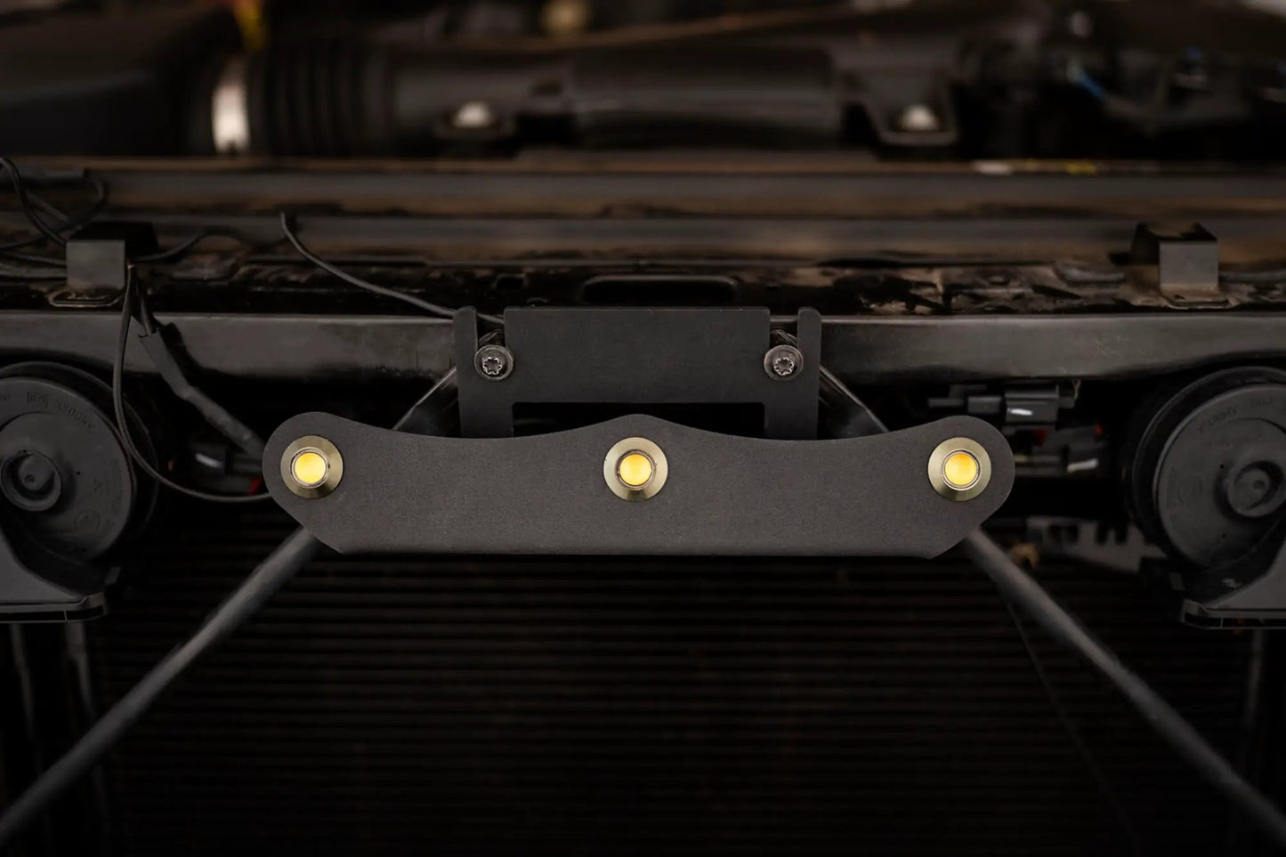 DV8 Offroad Set of three amber accent lights that install inside the front grill of the 20+ Jeep Gladiator JT. The mounting bracket is constructed from steel & powder coated & the LED lights allow your vehicle to be seen easier in low situations by DV8 Offroad