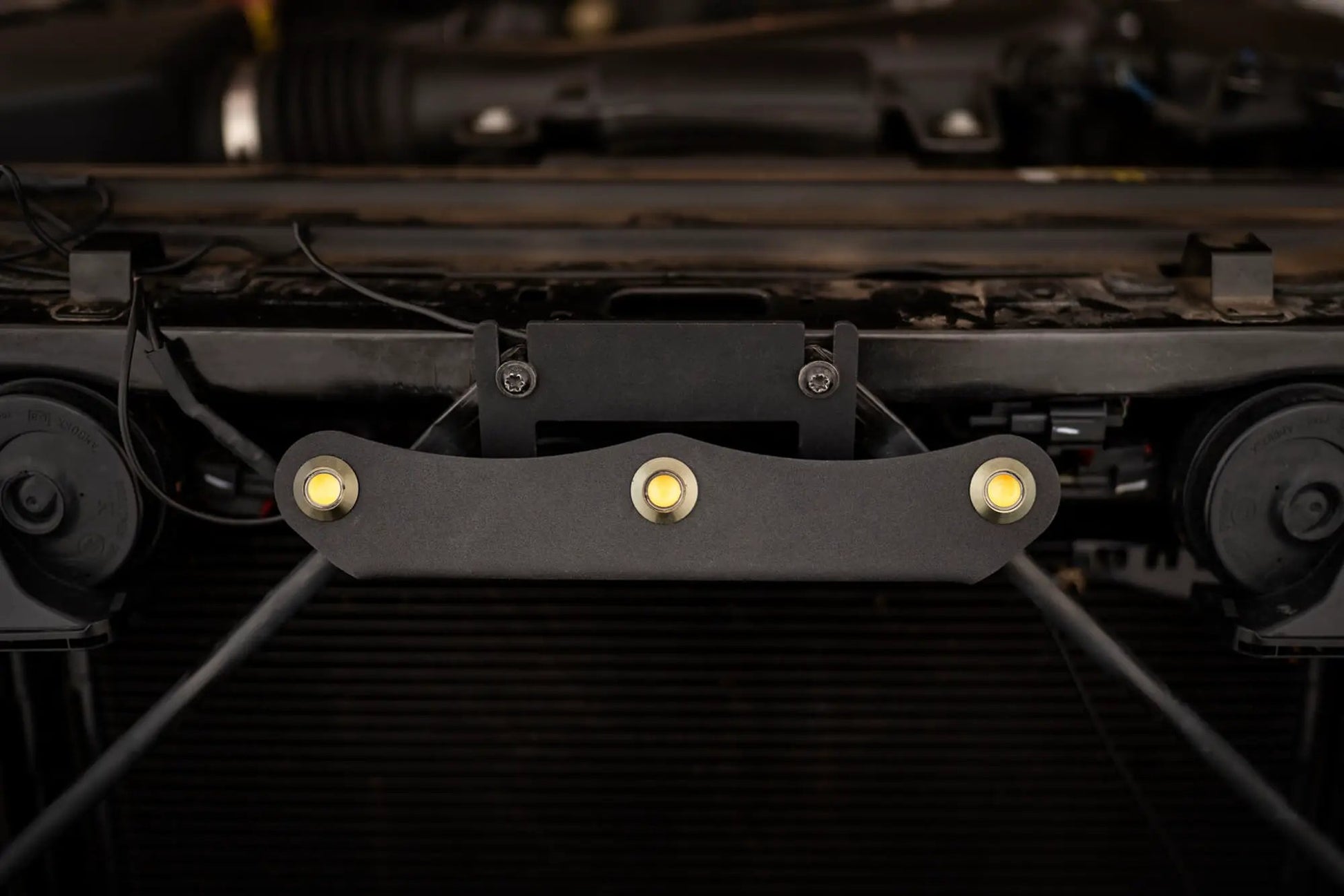 DV8 Offroad Set of three amber accent lights that install inside the front grill of the 20+ Jeep Gladiator JT. The mounting bracket is constructed from steel & powder coated & the LED lights allow your vehicle to be seen easier in low situations by DV8 Offroad