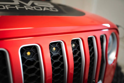 DV8 Offroad Set of three amber accent lights that install inside the front grill of the 20+ Jeep Gladiator JT. The mounting bracket is constructed from steel & powder coated & the LED lights allow your vehicle to be seen easier in low situations by DV8 Offroad