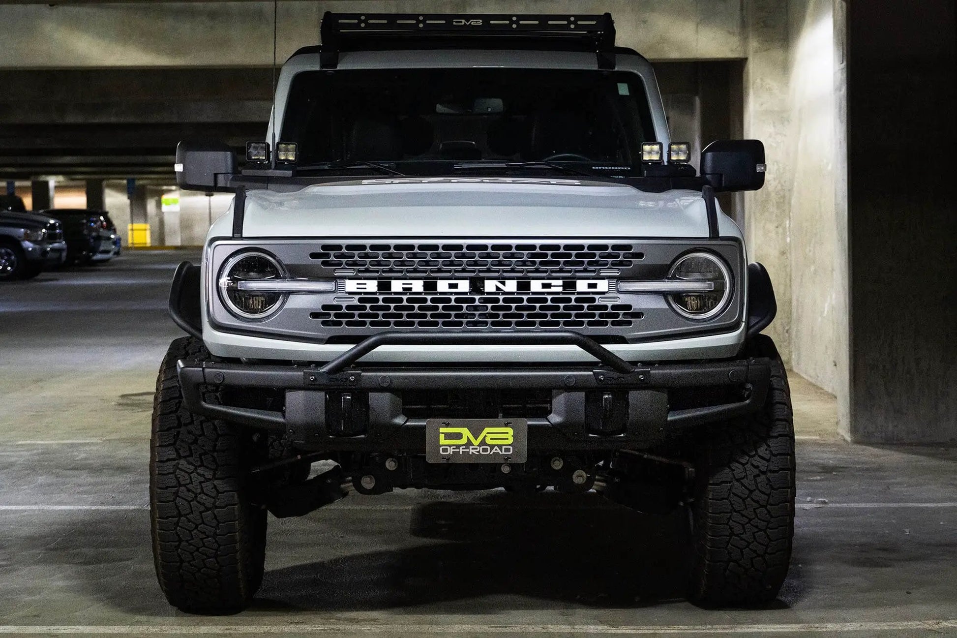 DV8 Offroad This front license plate relocation bracket places your license plate just below the center of your bumper at a slight angle by DV8 Offroad