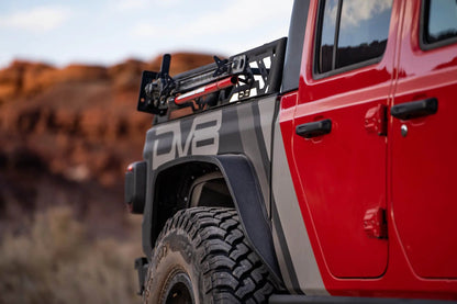 DV8 Offroad RRUN-01 is an adjustable bed mounted overland rack. The RRUN-01 is 8in. tall x 55in. wide and designed for both the Jeep Gladiator JT & Toyota Tacoma. Included are (2) Roto Pax mounts, (8) D-rings and a spot for a 6in. single row light bar