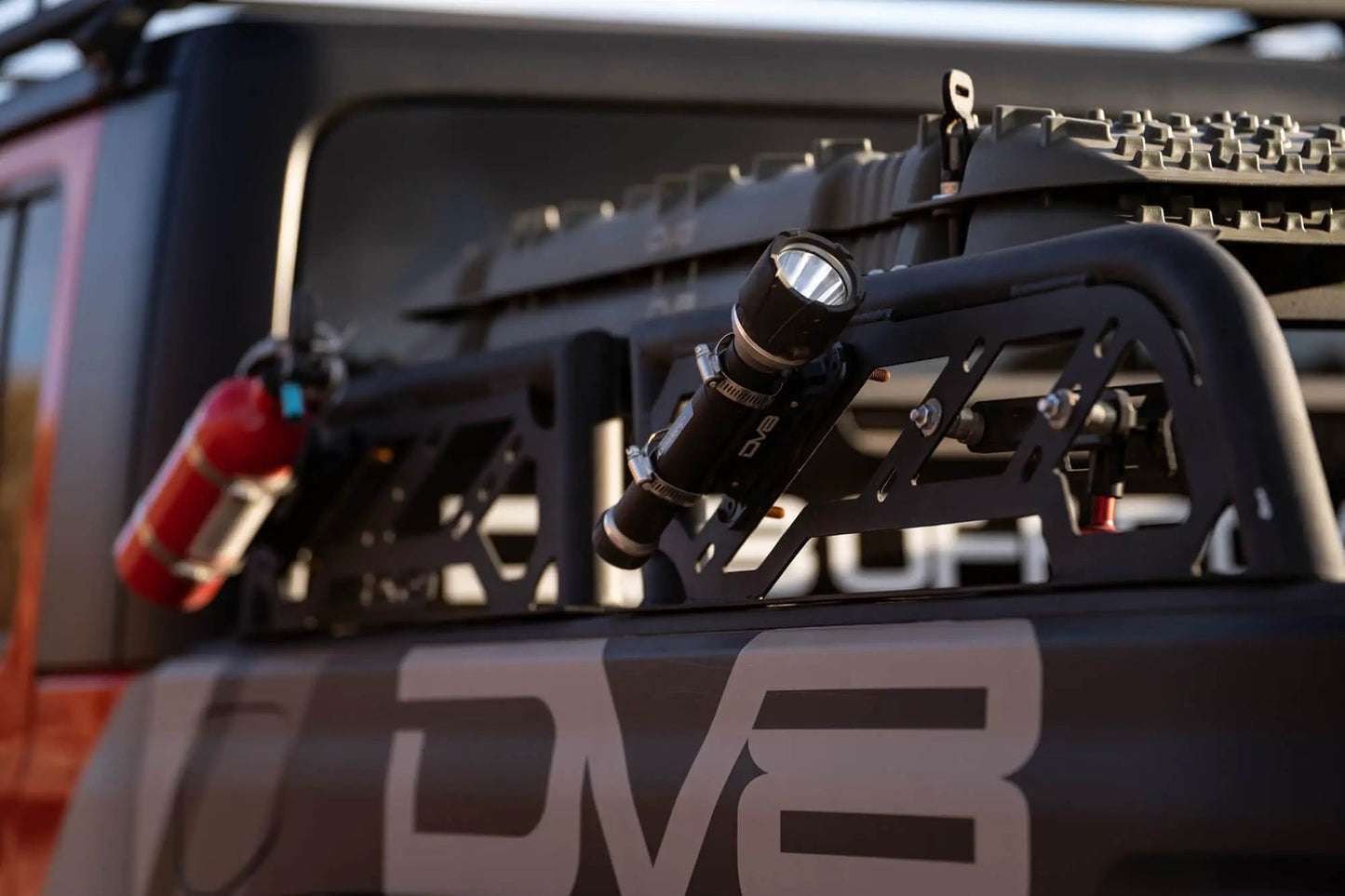 DV8 Offroad RRUN-01 is an adjustable bed mounted overland rack. The RRUN-01 is 8in. tall x 55in. wide and designed for both the Jeep Gladiator JT & Toyota Tacoma. Included are (2) Roto Pax mounts, (8) D-rings and a spot for a 6in. single row light bar