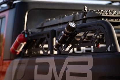 DV8 Offroad RRUN-01 is an adjustable bed mounted overland rack. The RRUN-01 is 8in. tall x 55in. wide and designed for both the Jeep Gladiator JT & Toyota Tacoma. Included are (2) Roto Pax mounts, (8) D-rings and a spot for a 6in. single row light bar