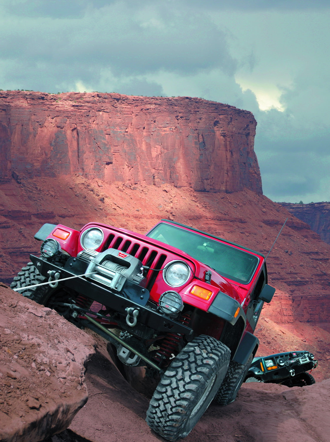 Warn Vehicle Mounted; Vehicle Recovery Winch; 12 Volt Electric; 9000 Pound Line Pull Capacity; 100 Foot Wire Rope; Roller Fairlead; Wired Remote; Planetary Gear Drive; Requires Winch Carrier or Winch Mount