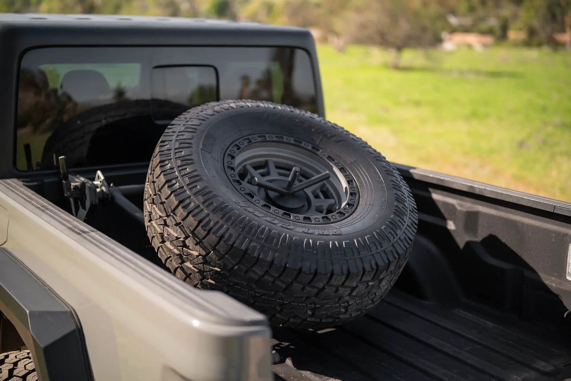 DV8 Offroad 2020-2025 Jeep Gladiator JT Adjustable In-Bed Tire Carrier by DV8 Offroad