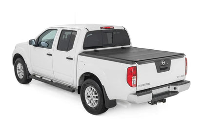 Rough Country Hard Tri-Fold Flip Up Bed Cover | 5' Bed | Nissan Frontier 2WD/4WD (05-21) by Rough Country
