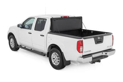 Rough Country Hard Tri-Fold Flip Up Bed Cover | 5' Bed | Nissan Frontier 2WD/4WD (05-21) by Rough Country