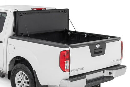 Rough Country Hard Tri-Fold Flip Up Bed Cover | 5' Bed | Nissan Frontier 2WD/4WD (05-21) by Rough Country