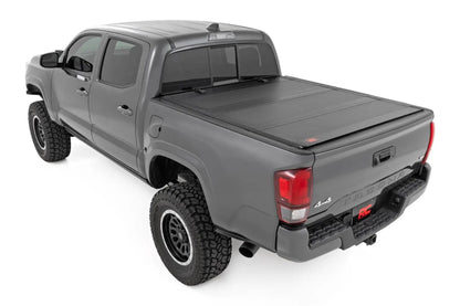 Rough Country Hard Tri-Fold Flip Up Bed Cover | 5' Bed | Toyota Tacoma 2WD/4WD (2005-2015) by Rough Country
