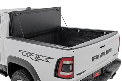 Rough Country Hard Tri-Fold Flip Up Bed Cover | 6'4" | Ram 1500 (19-26)/1500 TRX (21-24) by Rough Country