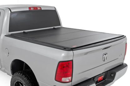 Rough Country Hard Tri-Fold Flip Up Bed Cover | 5'7" Bed | Ram 1500 2WD/4WD (2009-2018 & Classic) by Rough Country
