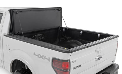Rough Country Hard Tri-Fold Flip Up Bed Cover | 5'7" Bed | Ford F-150 2WD/4WD (2004-2014) by Rough Country