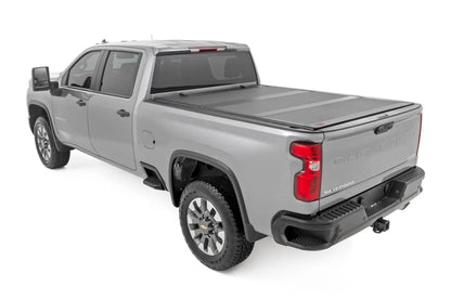 Rough Country Hard Tri-Fold Flip Up Bed Cover | 6'9" Bed | Chevy/GMC Silverado/Sierra 2500HD/3500HD (20-26) by Rough Country
