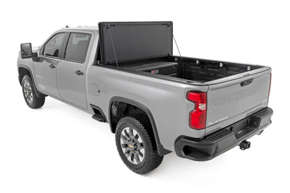 Rough Country Hard Tri-Fold Flip Up Bed Cover | 6'9" Bed | Chevy/GMC Silverado/Sierra 2500HD/3500HD (20-26) by Rough Country