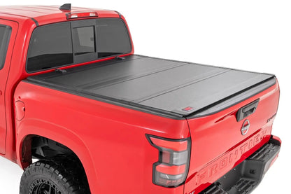 Rough Country Hard Tri-Fold Flip Up Bed Cover | 5' Bed | Nissan Frontier 2WD/4WD (22-26) by Rough Country