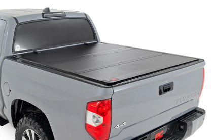 Rough Country Hard Tri-Fold Flip Up Bed Cover | 5'7" Bed | Toyota Tundra 2WD/4WD (07-21) by Rough Country