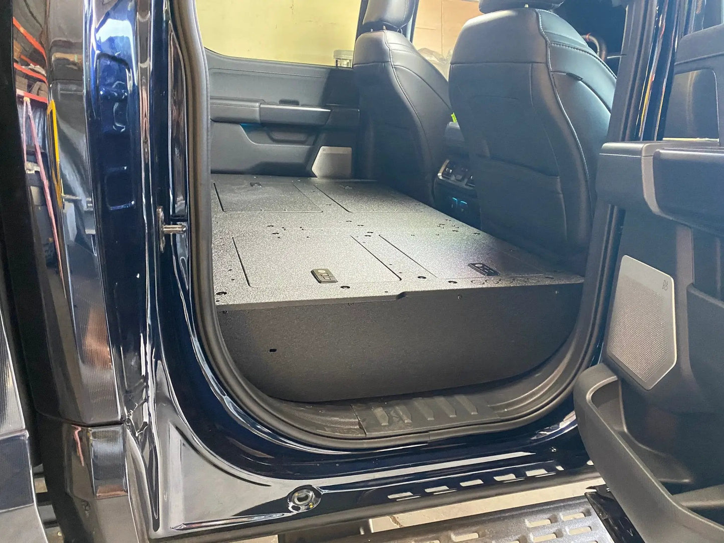Ford Super Duty Ford - F250-F550 - 2023-Present - 5th Gen. Crew Cab - Second Row Seat Delete Plate System with Factory B&O Subwoofer Center Wall with Exterior Port by Goose Gear