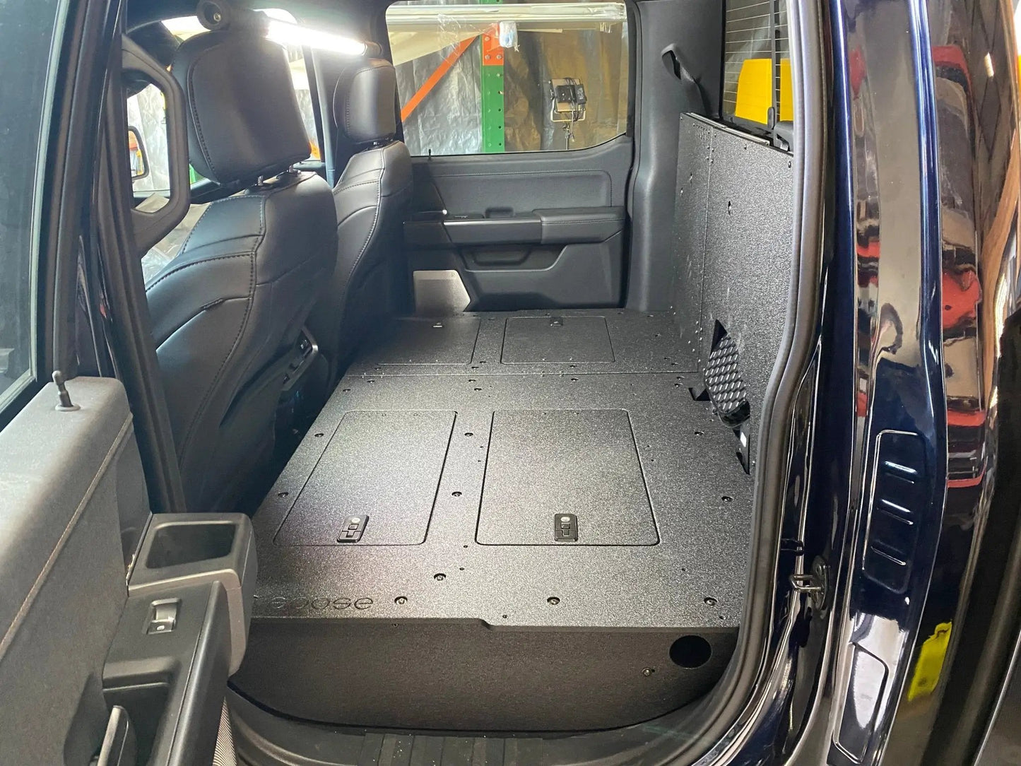 Ford Super Duty Ford - F250-F550 - 2023-Present - 5th Gen. Crew Cab - Second Row Seat Delete Plate System with Factory B&O Subwoofer Center Wall with Exterior Port by Goose Gear
