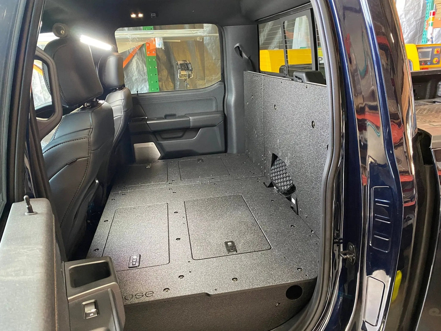 Ford Super Duty Ford - F250-F550 - 2023-Present - 5th Gen. Crew Cab - Second Row Seat Delete Plate System with Factory B&O Subwoofer Center Wall with Exterior Port by Goose Gear