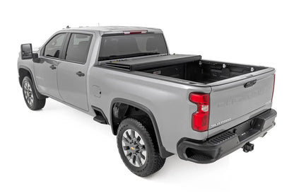 Rough Country Hard Tri-Fold Flip Up Bed Cover | 6'9" Bed | Chevy/GMC Silverado/Sierra 2500HD/3500HD (20-26) by Rough Country