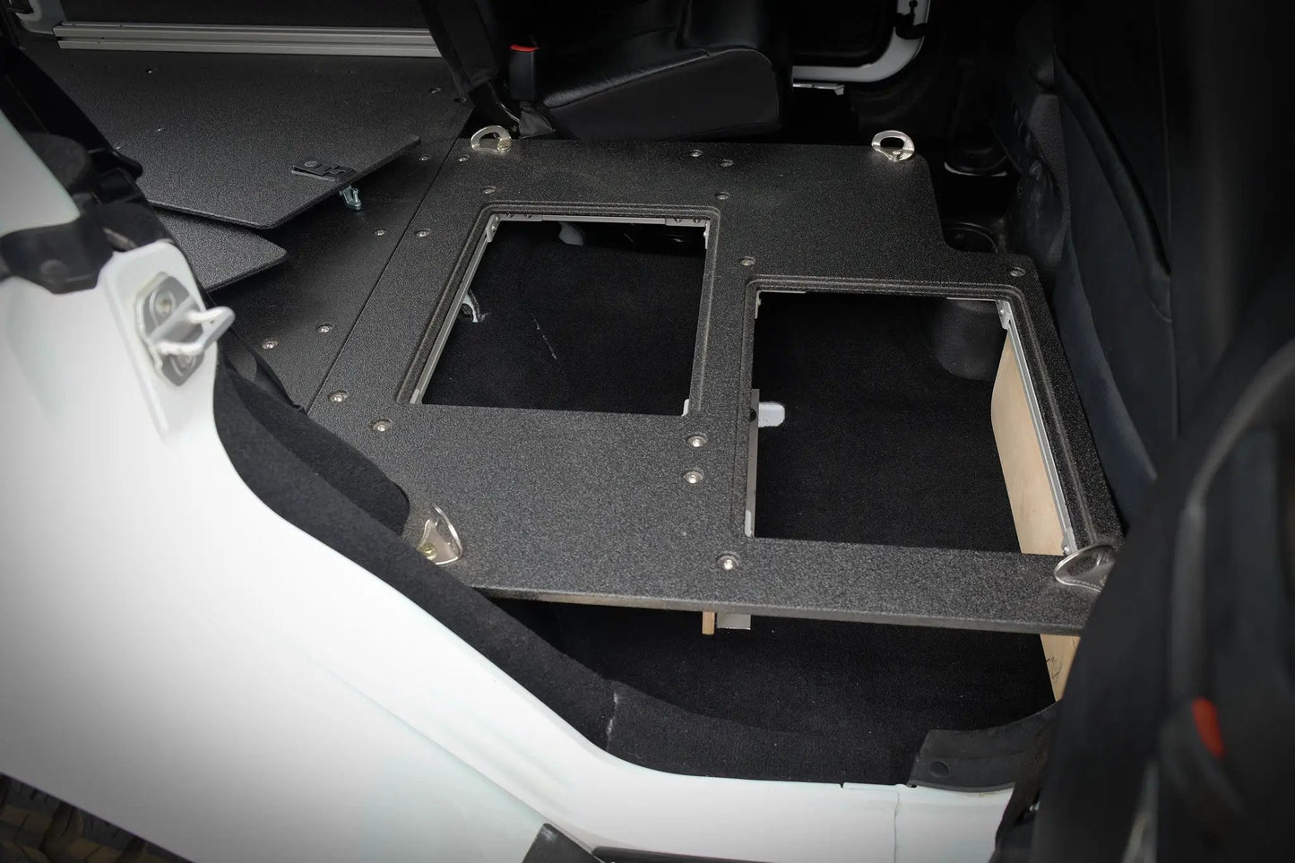Legacy Product - Jeep Wrangler 2007-2018 JKU 4 Door - Second Row Seat Delete Plate System by Goose Gear