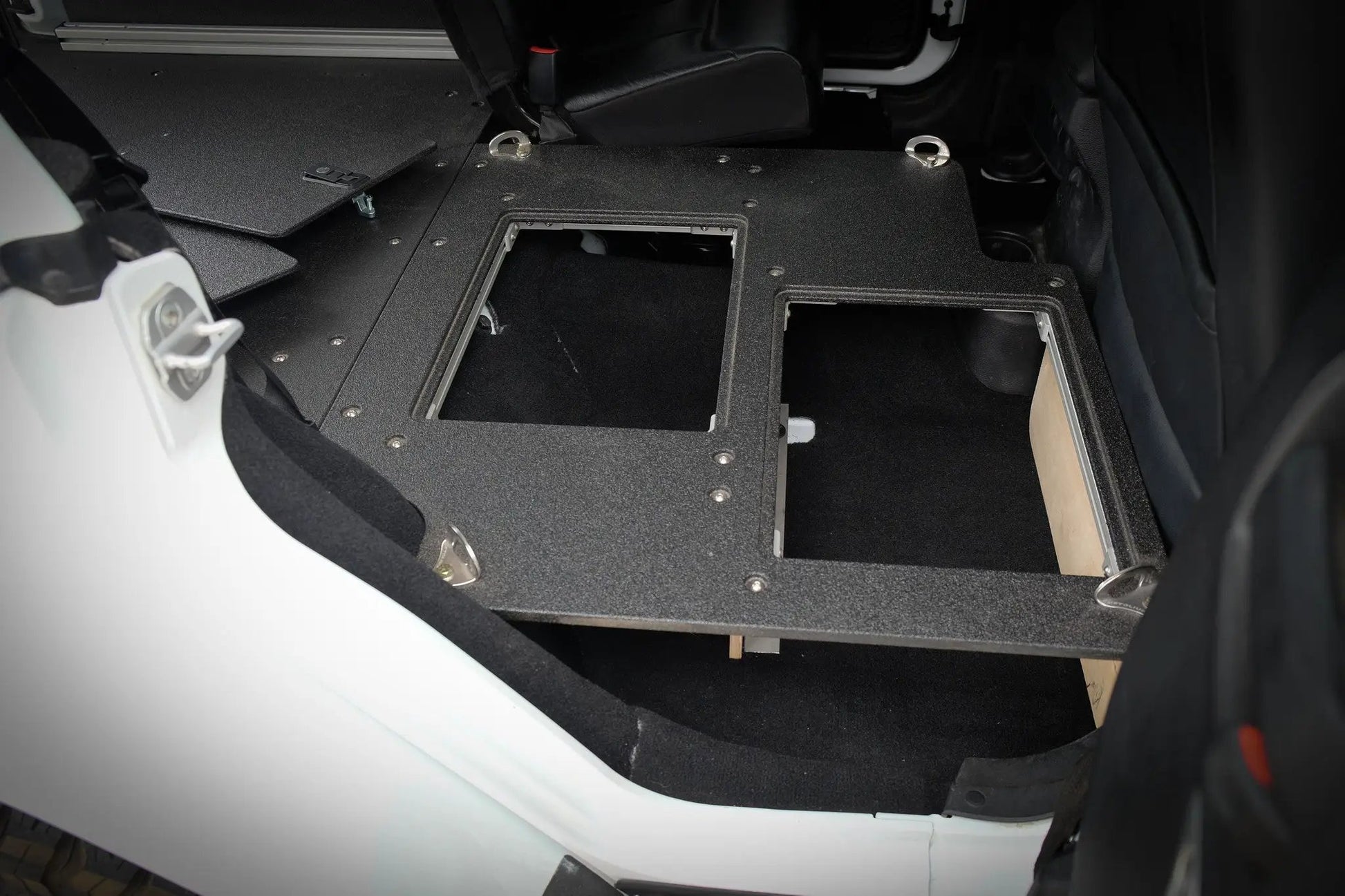 Legacy Product - Jeep Wrangler 2007-2018 JKU 4 Door - Second Row Seat Delete Plate System by Goose Gear